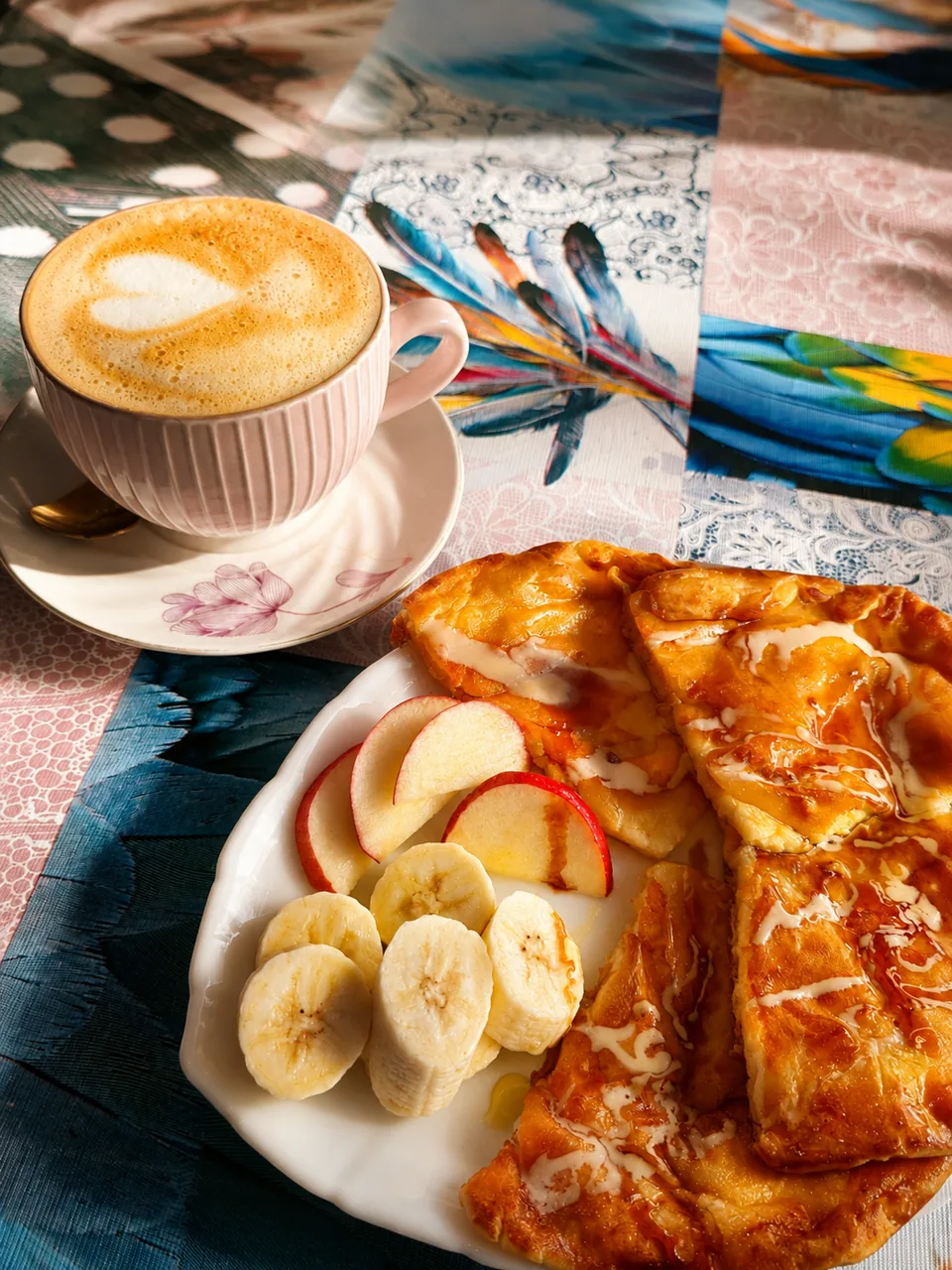 Coffee and breakfast served on a colourful patterned table